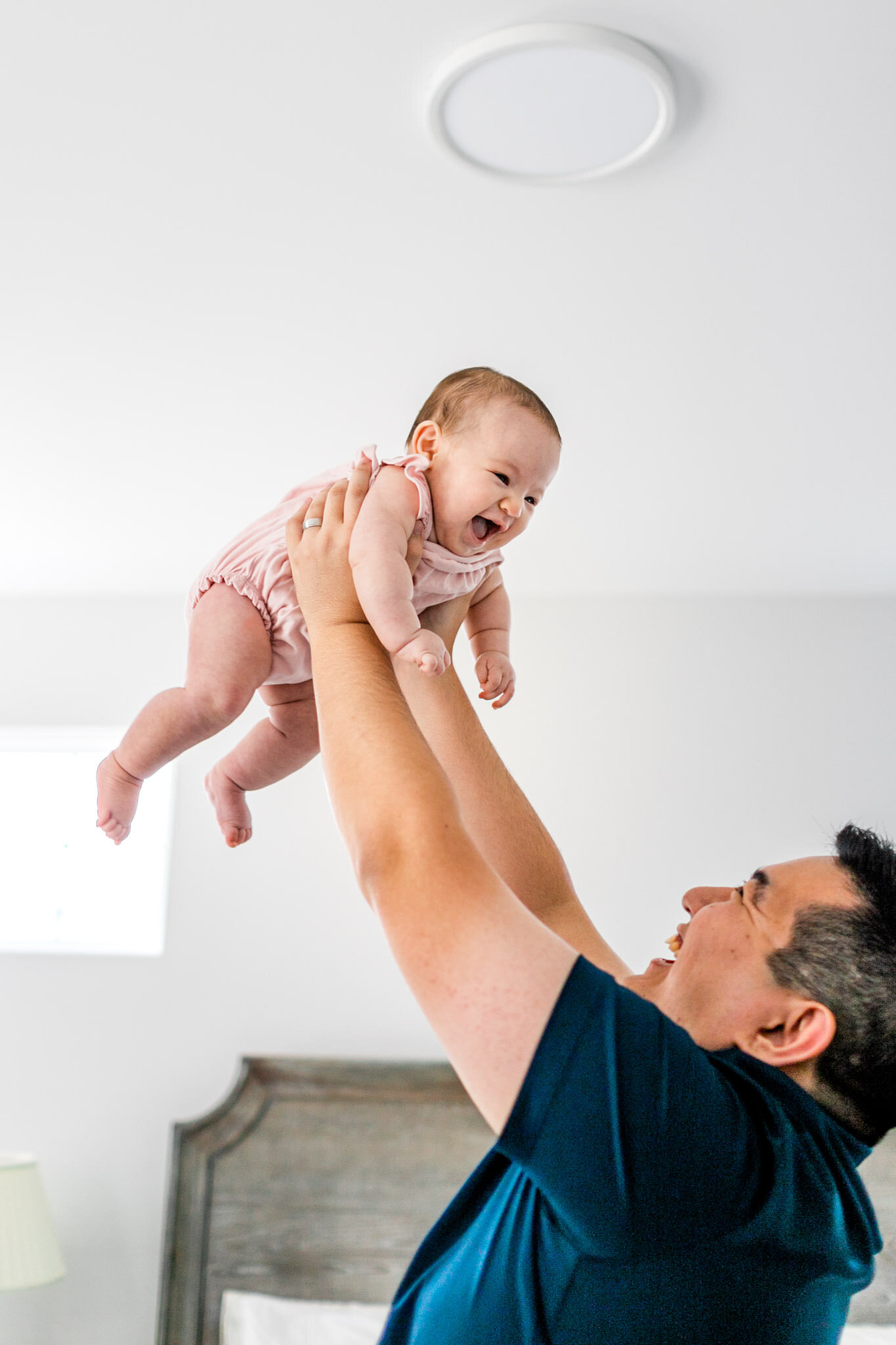 Raleigh Family Photographer | By G. Lin Photography | Dad holding up baby girl