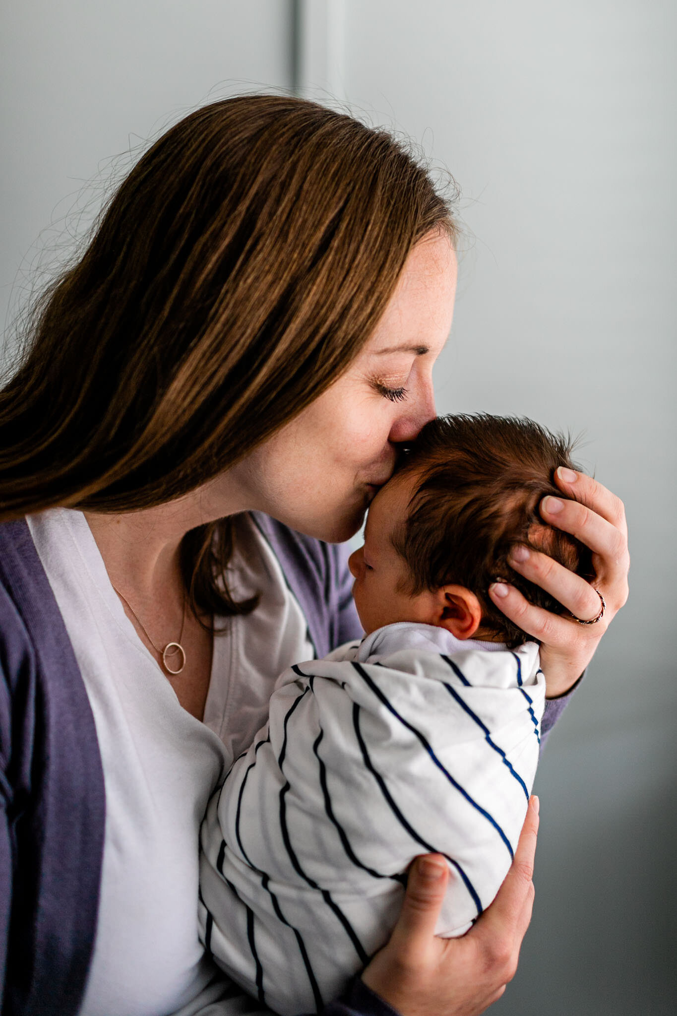 Durham Newborn Photographer | By G. Lin Photography | Woman kissing baby