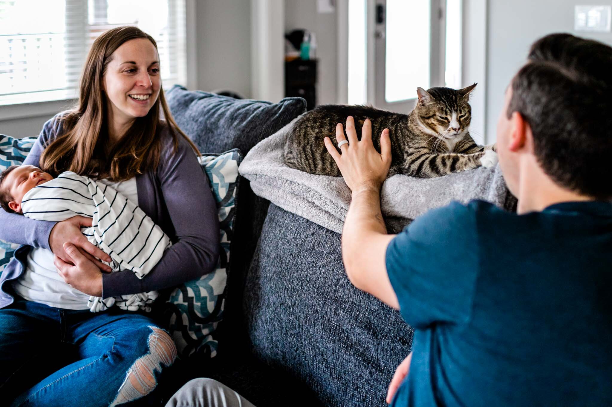 Durham Newborn Photographer | By G. Lin Photography | Family sitting on couch and petting cat