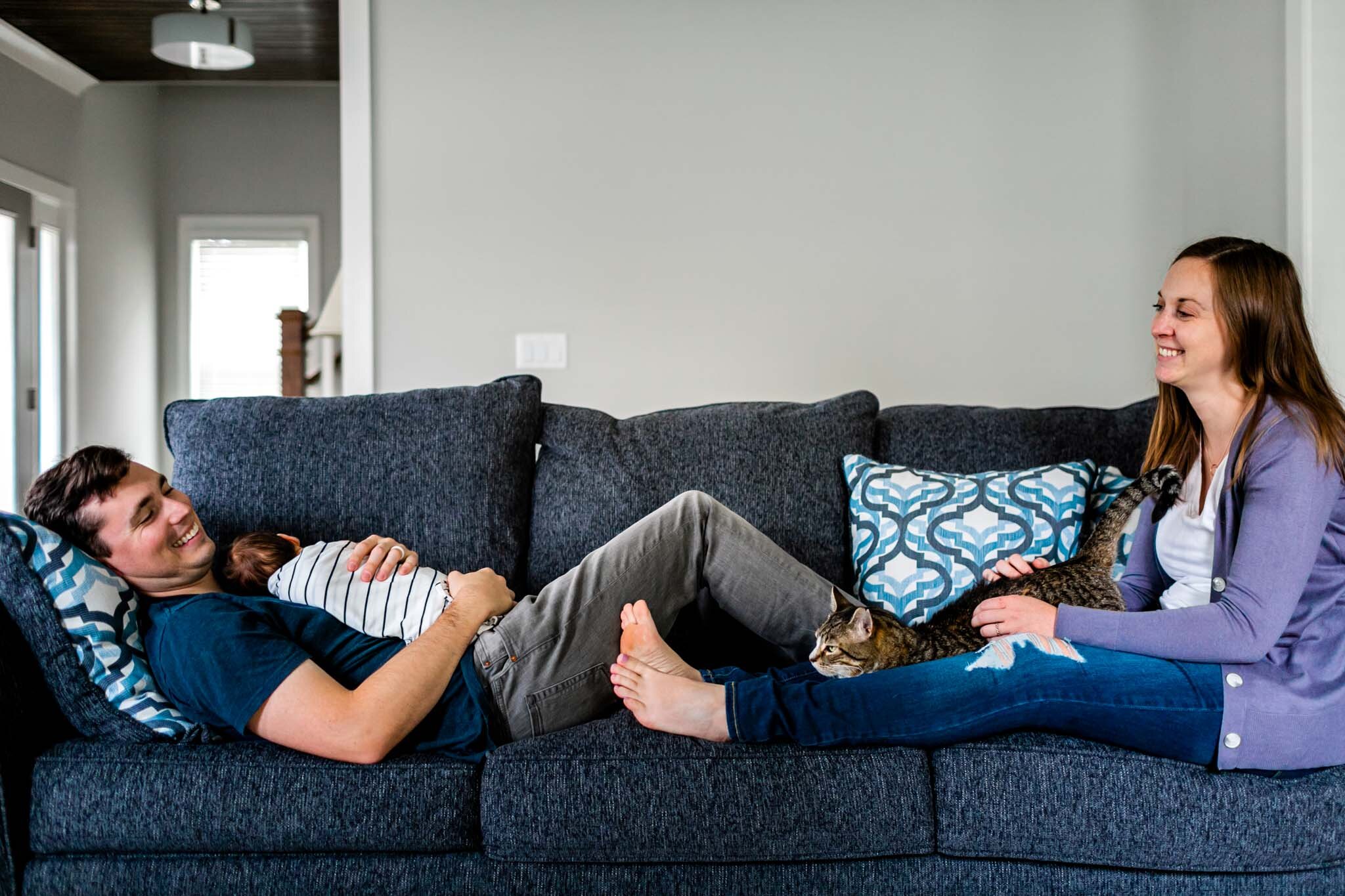 Durham Newborn Photographer | By G. Lin Photography | Relaxing family shot sitting on couch in living room