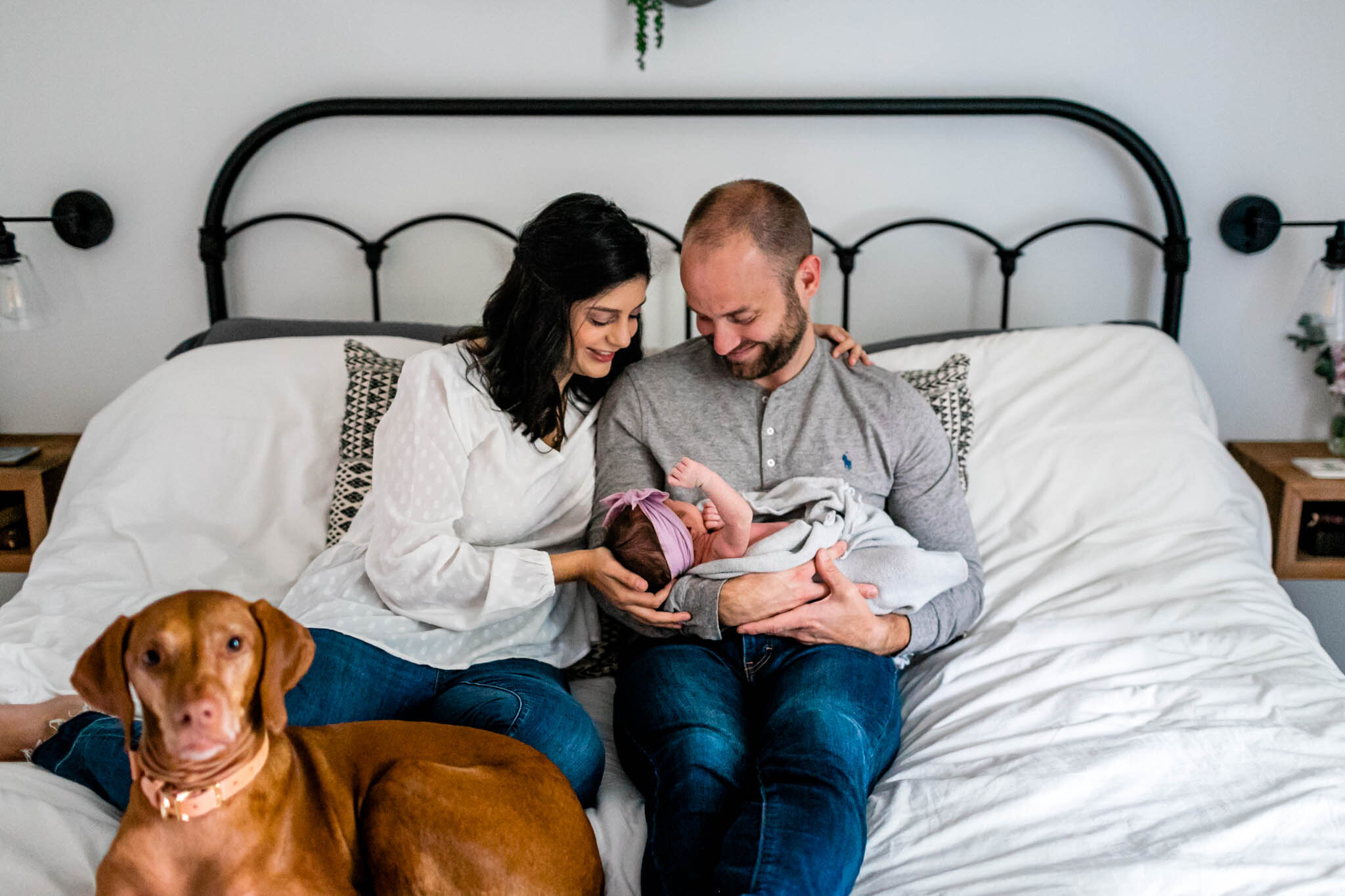 Charlotte Newborn Photographer | By G. Lin Photography | Family sitting on bed with baby