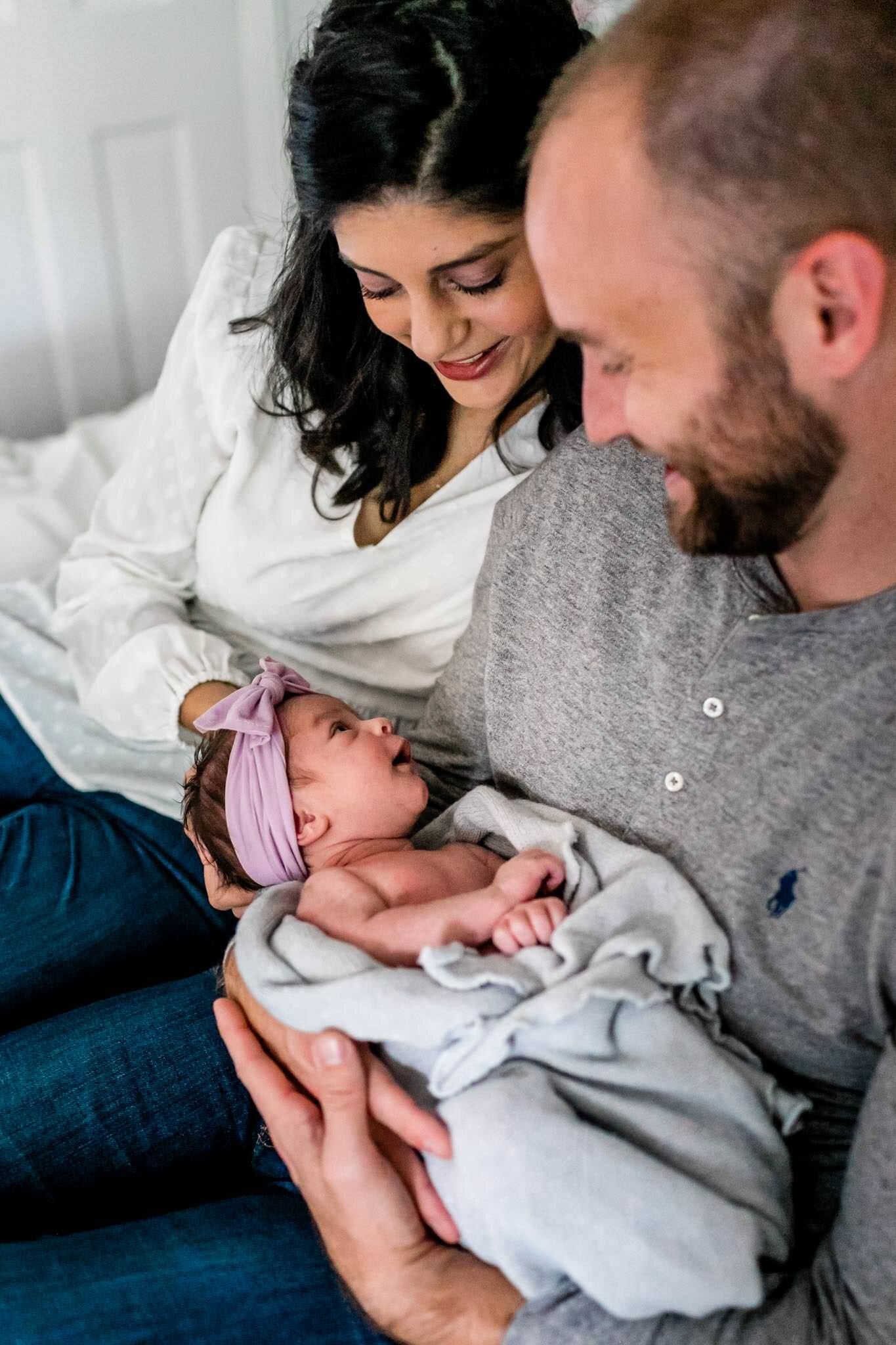 Charlotte Newborn Photographer | By G. Lin Photography | Mother and father holding baby 