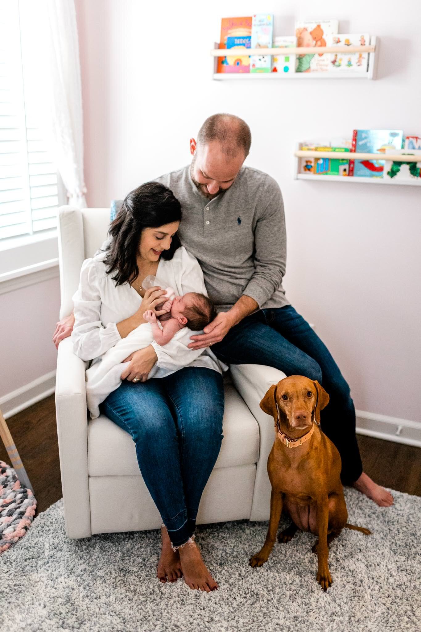 Charlotte Newborn Photographer | By G. Lin Photography | Couple sitting in nursery with baby girl