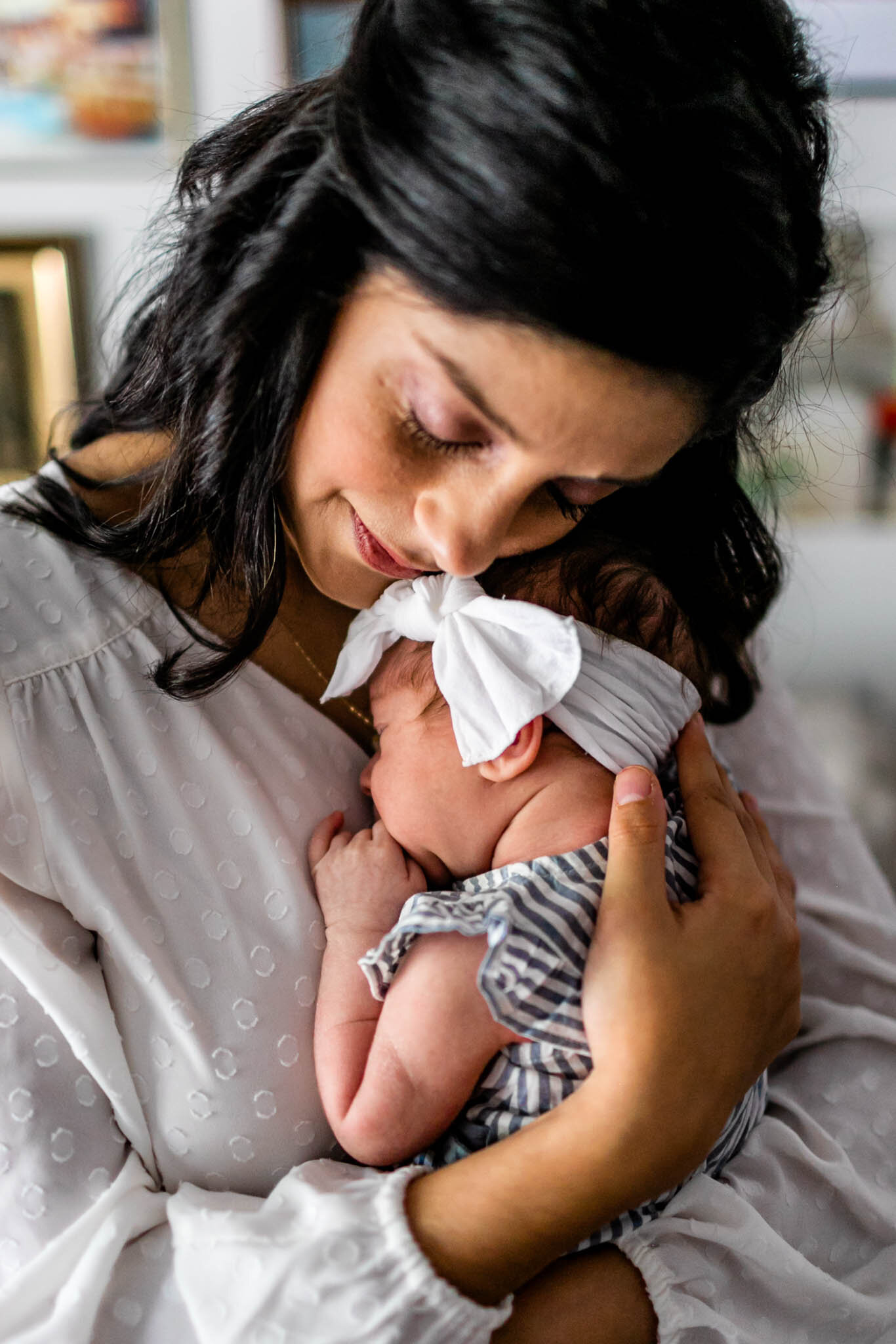 Charlotte Newborn Photographer | By G. Lin Photography | Mother embracing baby girl
