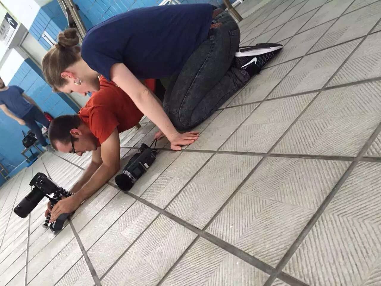 Setting up a close shot at the swimming pool with director Antonia Meile.