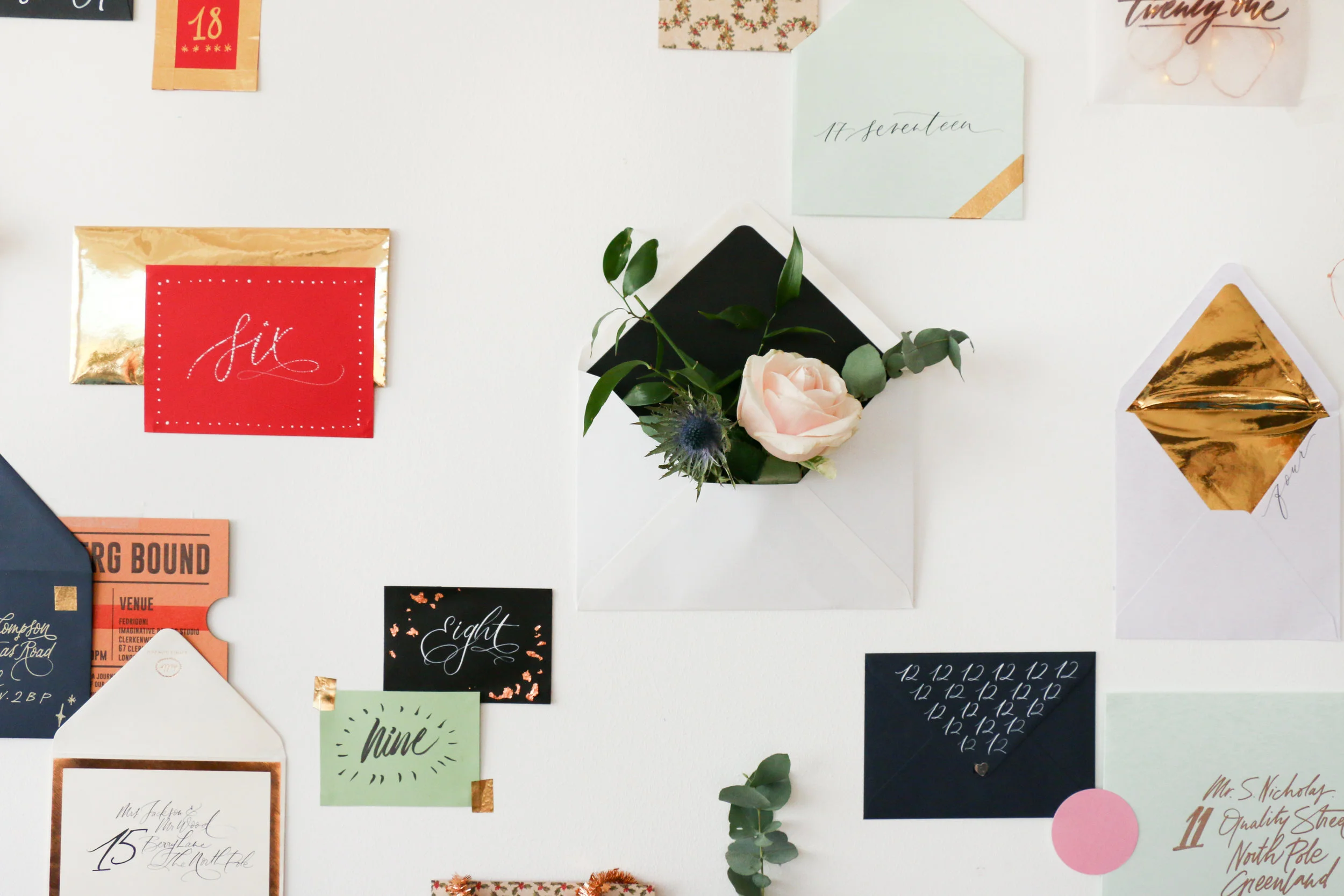 Beautiful stationery makes us weak at the knees, and our envelope advent wall is bursting with gifts, flowers, and lettering loveliness as a thank you to all of our Lamplighter community this year. Play along daily on Instagram and Facebook , where we will be opening a beautiful envelope each day, look out for prizes to be won, including a signed copy of Nib + Ink, free downloads, super cool gifts from some of our favourite brands (including Manuscript and Birchbox amongst many others), and of course some of our lovely lettering - perfect to jazz up this years Christmas cards and gift tags. Today is number one, the first day of advent, and our gift is 10% off our Christmas shop online, until midnight tonight. Simply enter 10ADVENT on check out, and enjoy hand lettered gift wrap and paper goods. Bring on the mulled wine!