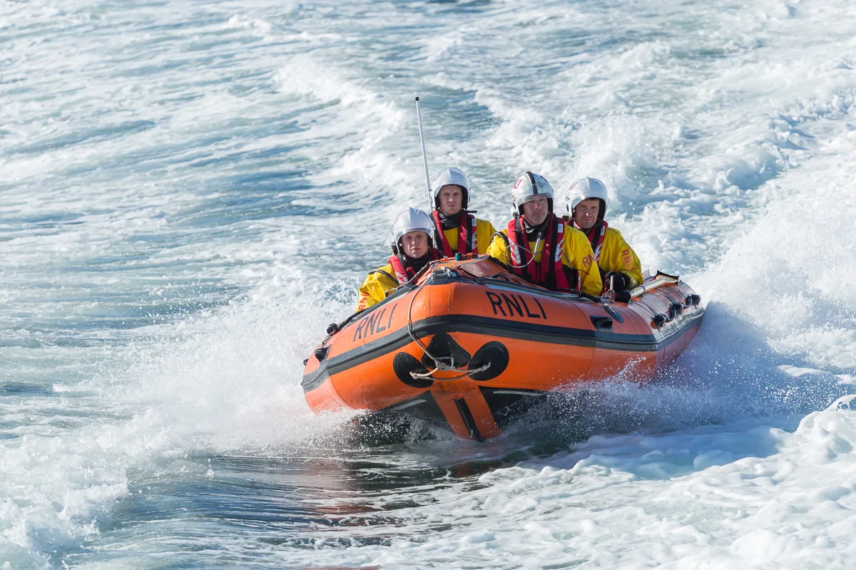 Kieran (left) gets a taste of life on the D-class inshore lifeboat (ILB) (photo: Nick Mailer)