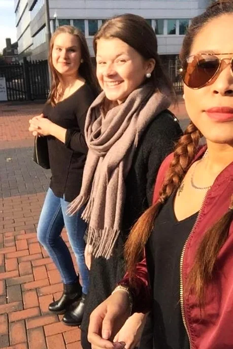Linn (far left) with two classmates in London.