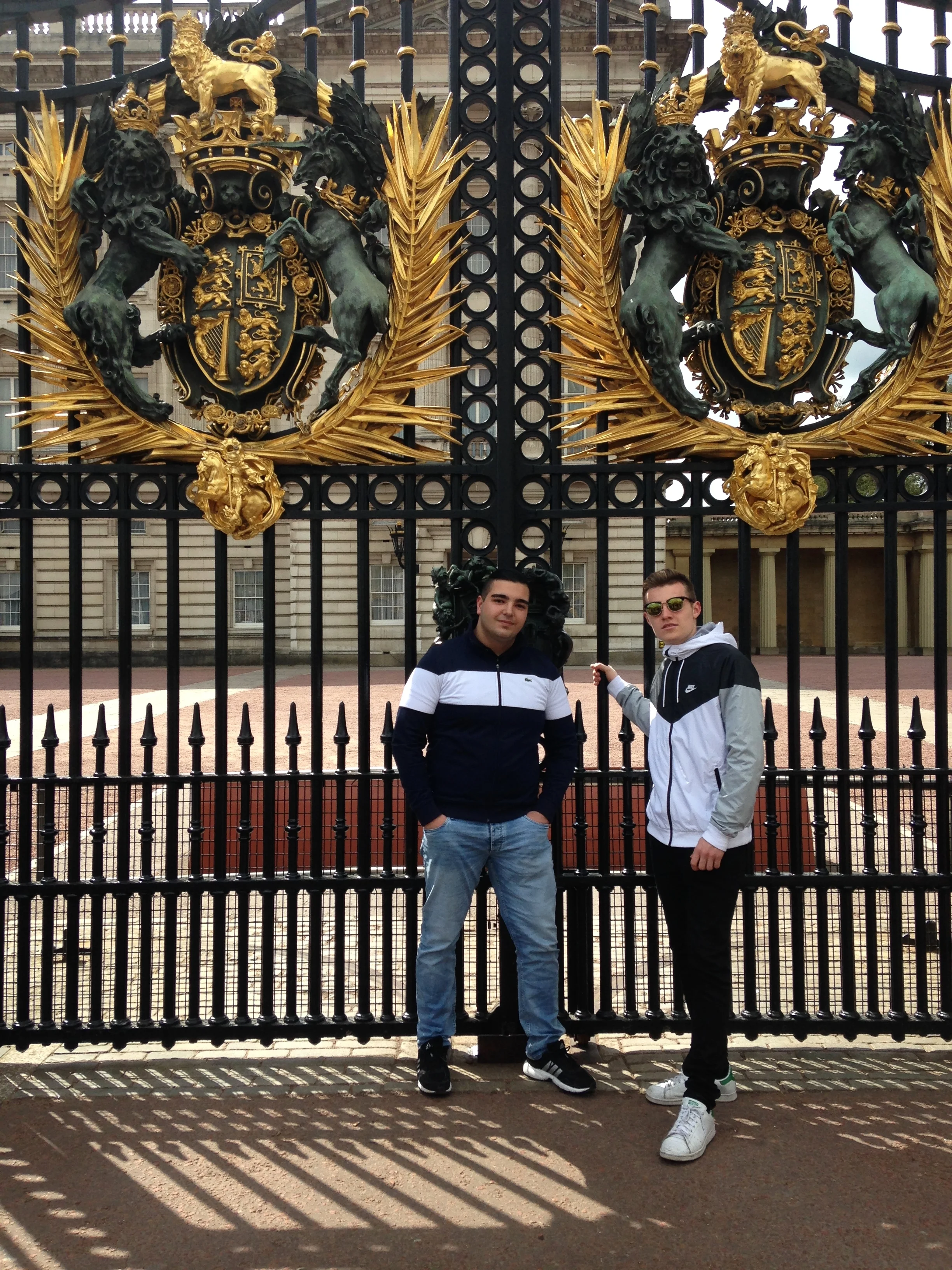 Gökai with a friend outside Buckingham Palace.