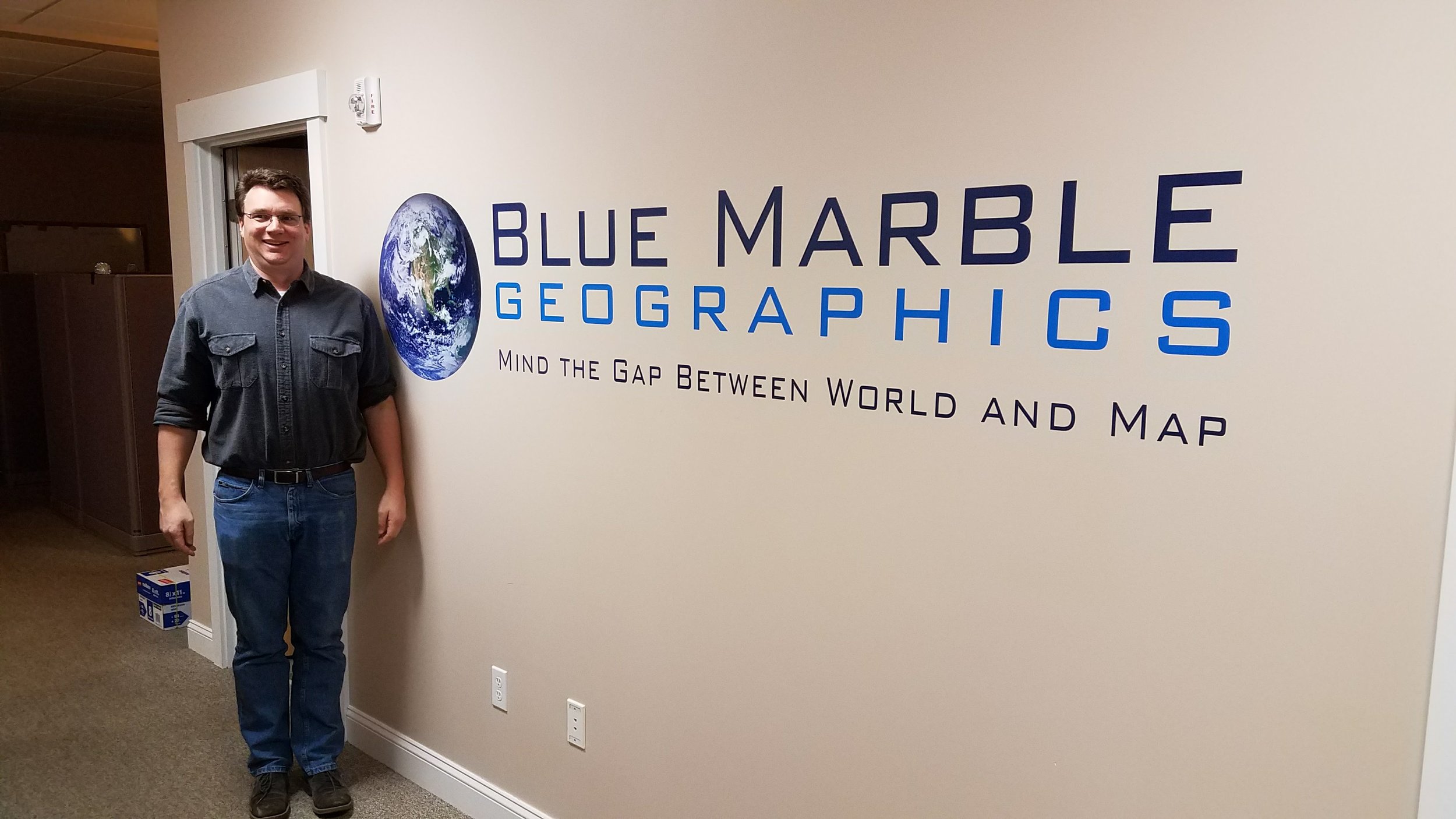 Thadd at the Blue Marble Geographics office in Maine.