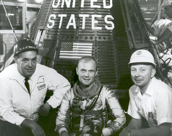 January 24, 1962: John Glenn With T.J. O'Malley and Paul Donnelly in Front of Friendship 7. Grouped together with astronaut John H. Glenn, Jr., beside "Friendship 7" spacecraft are left to right: T.J. O'Malley, chief test conductor for General Dynamics; Glenn; and Paul Donnelly. Image # : 62-MA6-58 .