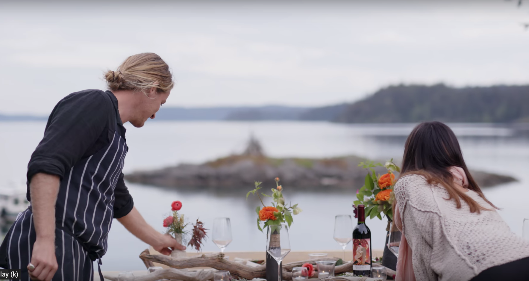 Ayame and guy set up for a dinner in front of Pebble Cove