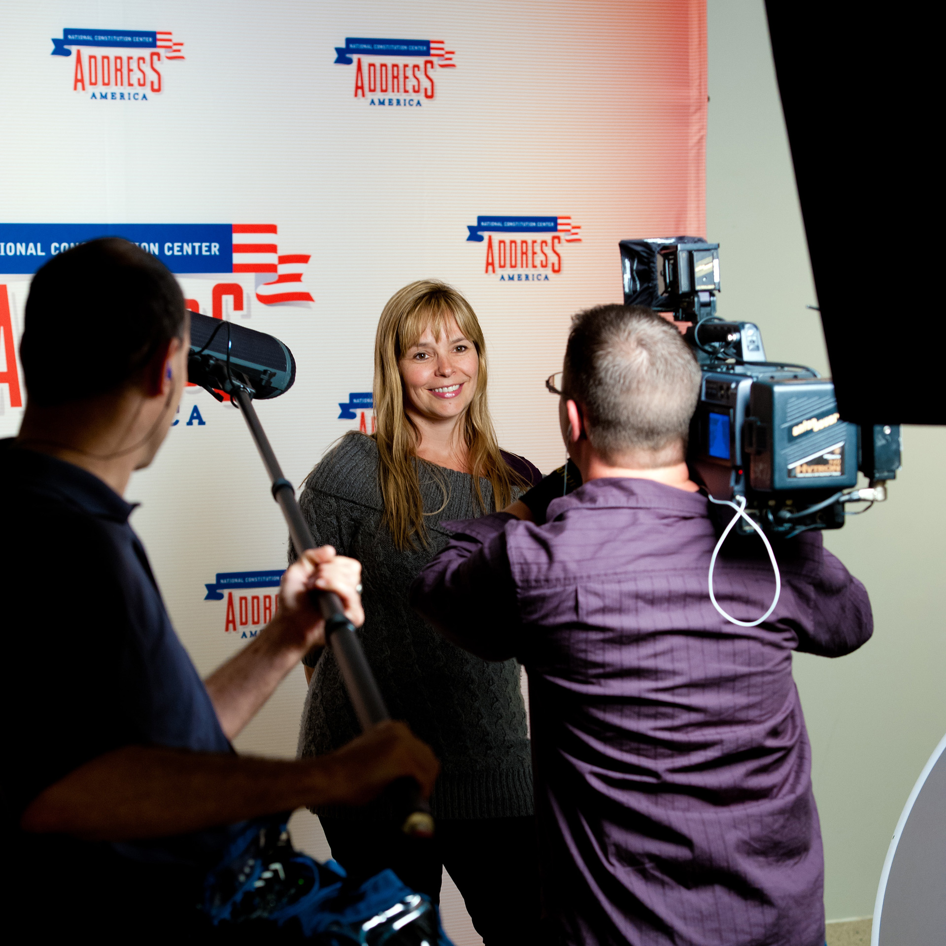 Photo shoot with the brand identity as a backdrop.