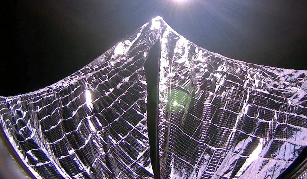 Image of the deployed solar sails in earth orbit.