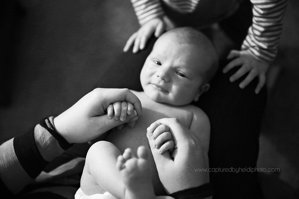 12-central-iowa-newborn-photographer-captured-by-heidi-photography-heidi-hicks-huxley-ankeny-desmoines-in-home-lifestyle-session-big-sister-crib-michelle-haupt.png