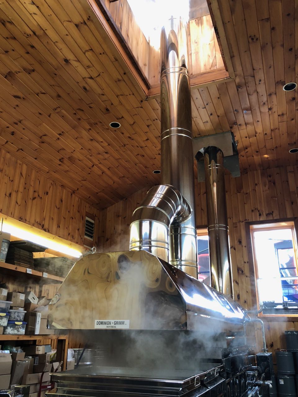 The product offerings and evaporator at Morning Star Maple. &nbsp;The steam from the sap literally streams directly out an opening in the roof!