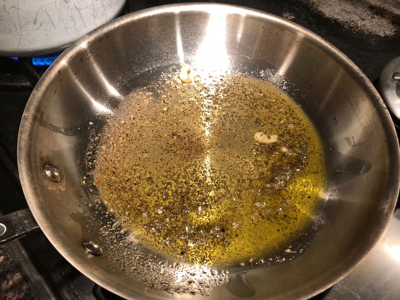 heating oil and spices in a skillet