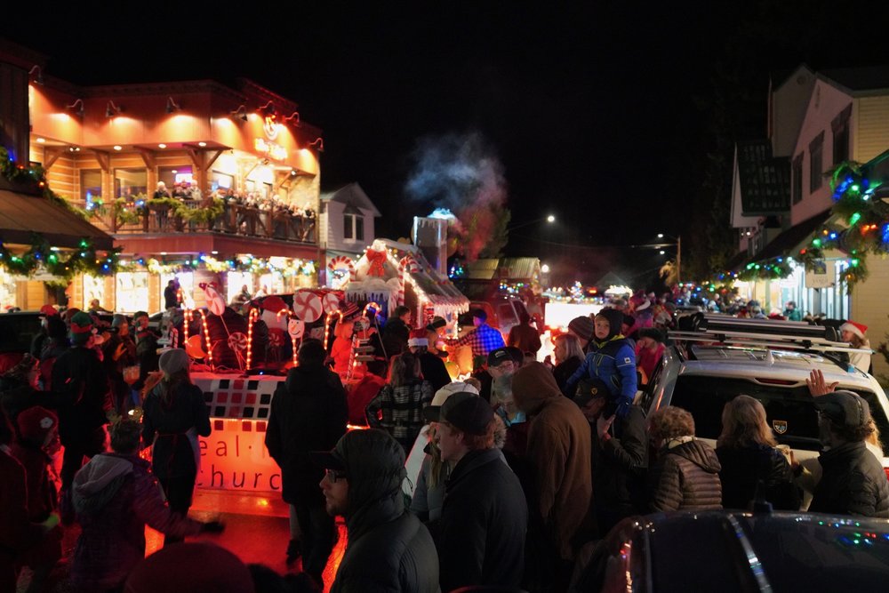 A crowd gathers on a temperate December night for the Annual Bigfork, MT. Christmas Parade.