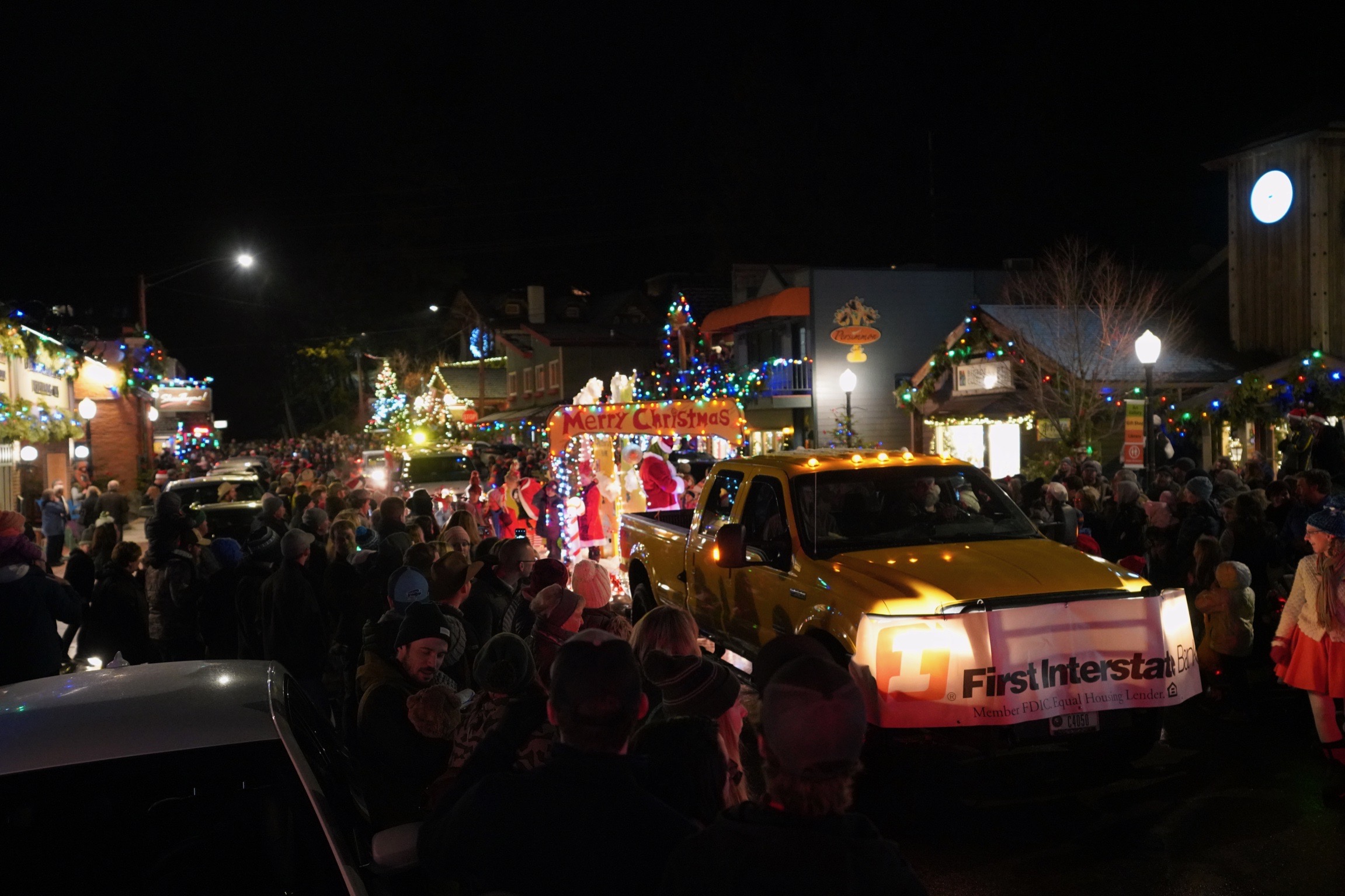 A crowd gathers on a temperate December night for the Annual Bigfork, MT. Christmas Parade.
