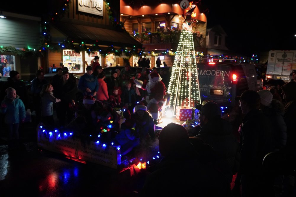 A crowd gathers on a temperate December night for the Annual Bigfork, MT. Christmas Parade.