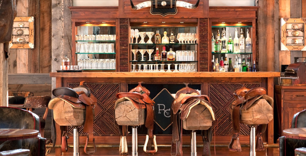 The bar, bowling alley and movie room inside the Silver Dollar Saloon at The Ranch at Rock Creek, photos courtesy of their web site.  