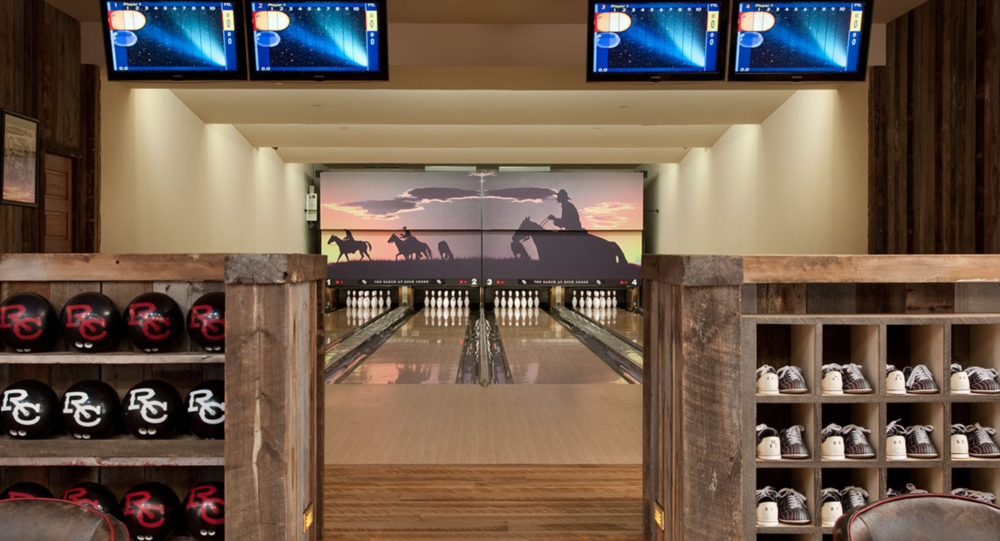 The bar, bowling alley and movie room inside the Silver Dollar Saloon at The Ranch at Rock Creek, photos courtesy of their web site.  