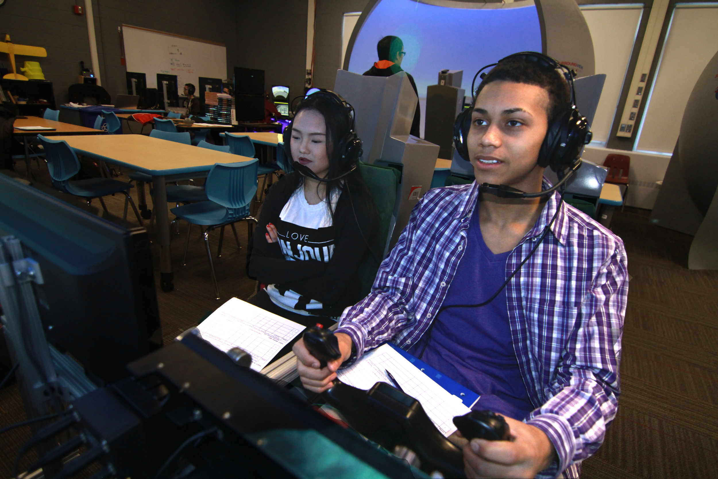 Students working together, Dual Seat Flight Simulator 