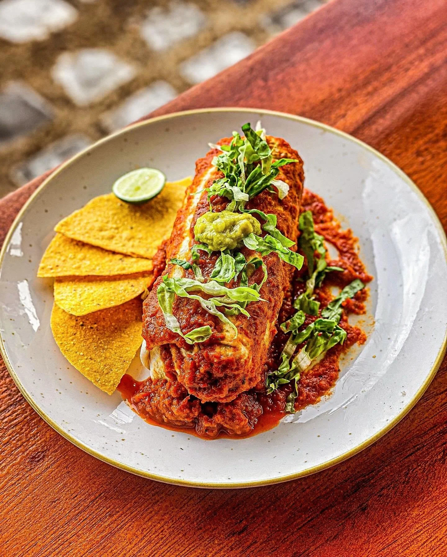 Vegan Wet Burrito ❤️🙏❤️
@tacocasabali
Vegan, Healthy, Spicy and Delicious.
- 8-layer burrito topped with enchiladas sauce. Stuffed with grilled fajita style veggies, rice and beans.