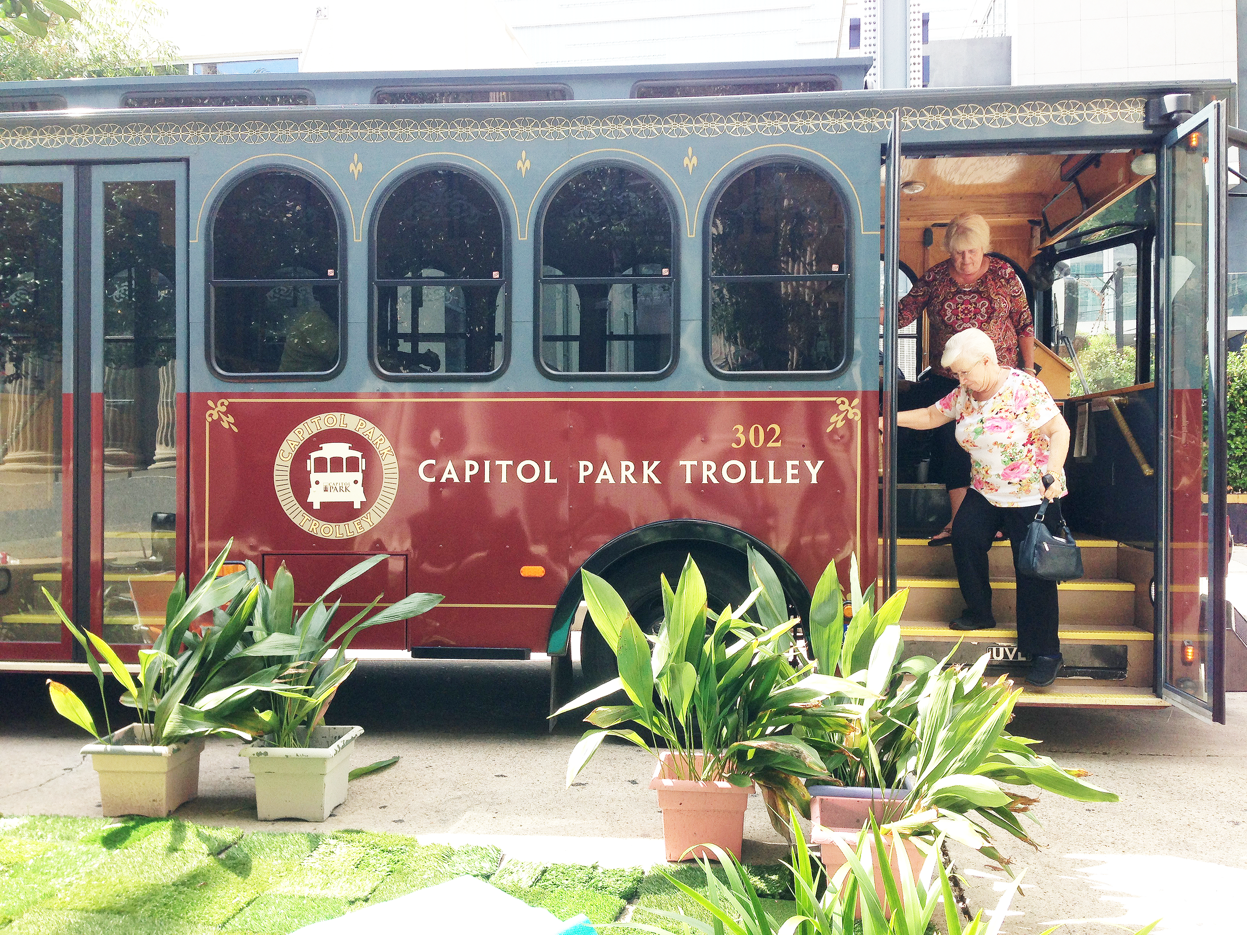Riders are met by a PARK(ing) Day installation outside a stop on the Capitol Park Trolley route.