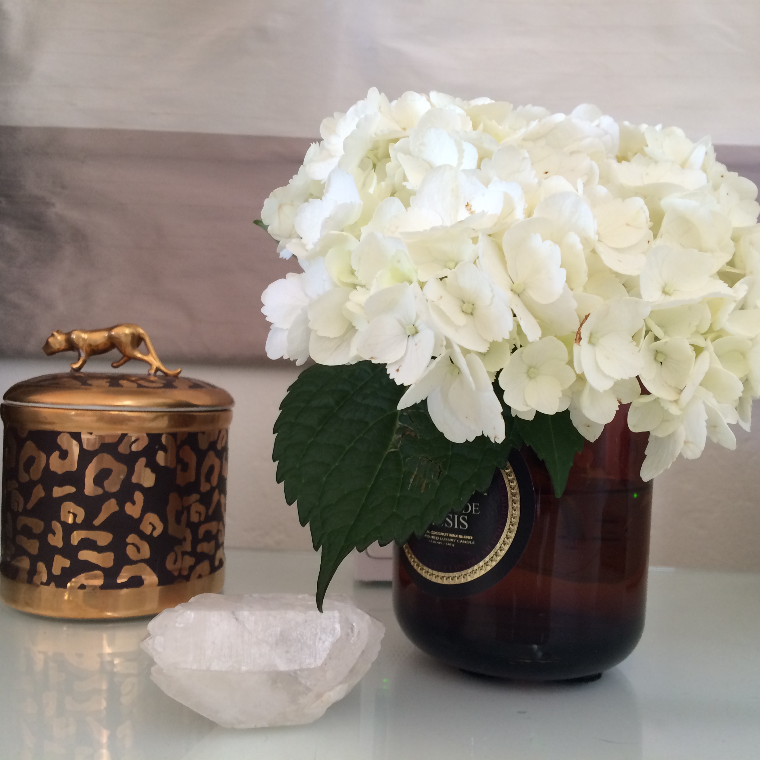Here is a glimpse of my bedside table right now...who needs a vase! 