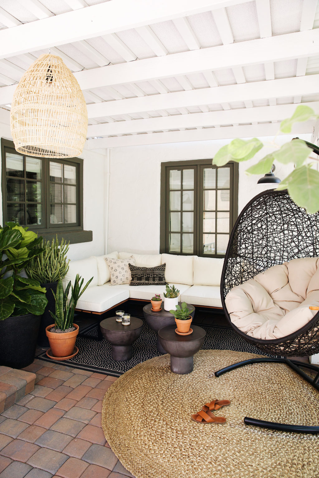This space from the New Darlings was really easy for them to achieve. New rugs, side tables, simple couch, plants and a hanging chair...voila!