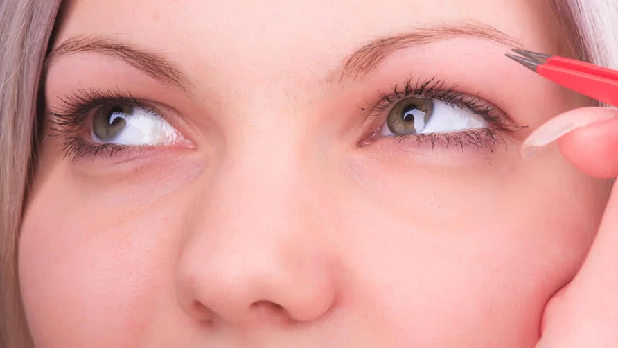 Beautiful-girl-plucking-eyebrows-with-tweezers.jpg