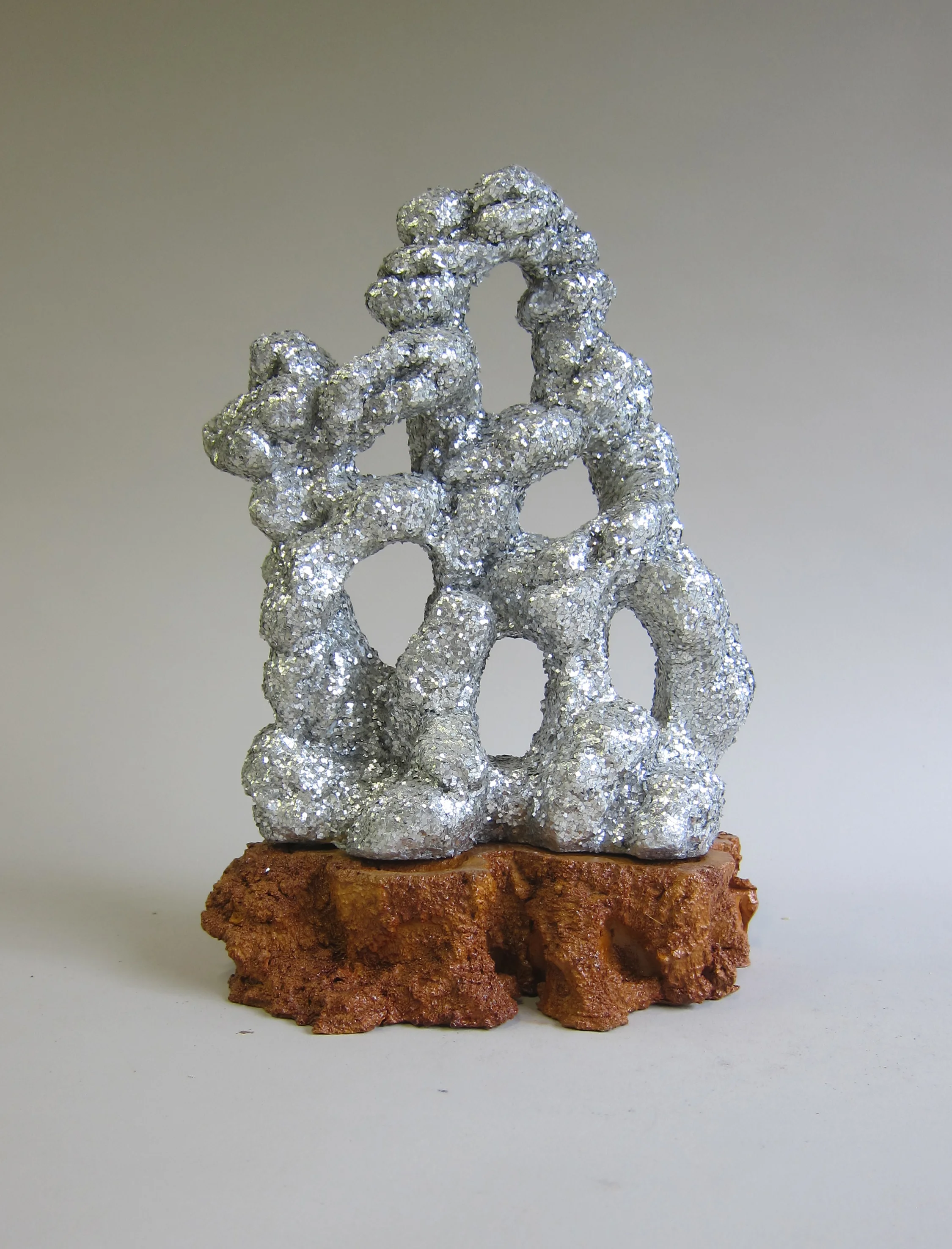   Fiberglass, glitter, ceramic, shellac.&nbsp;  