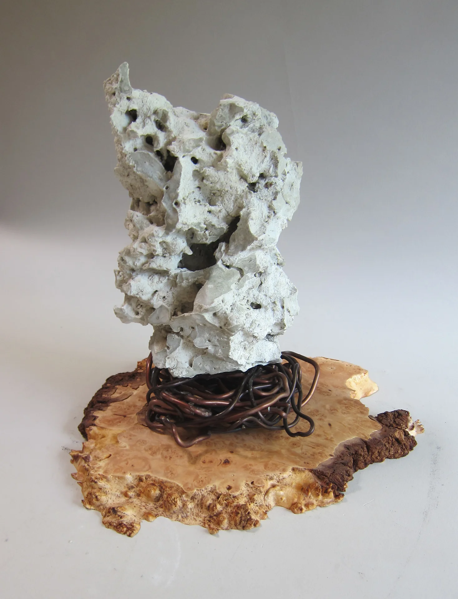   Mojave desert stone, aluminum wire, wood burl.&nbsp;  