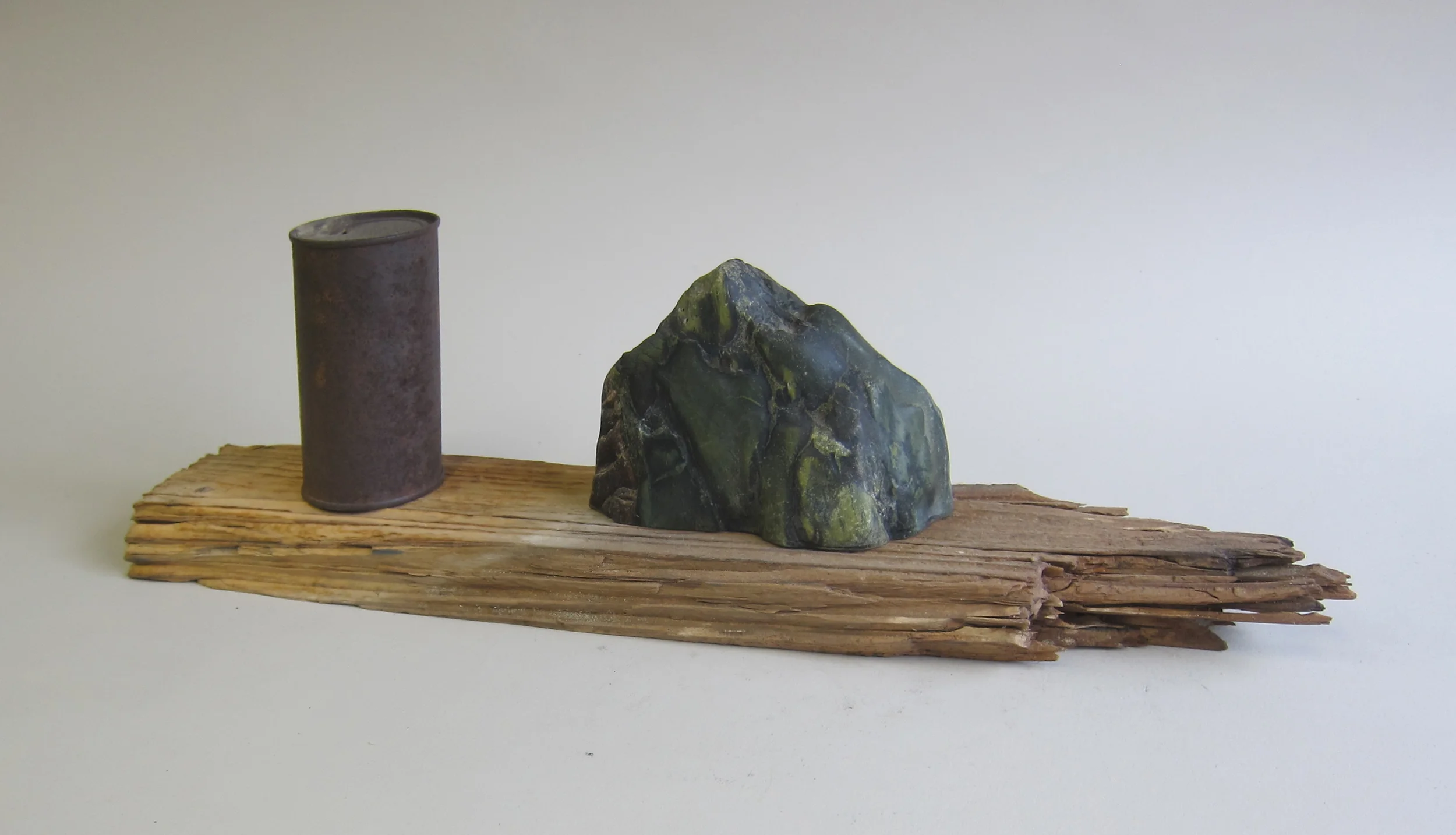   Northern California serpentine, rusted can, wood.&nbsp;  