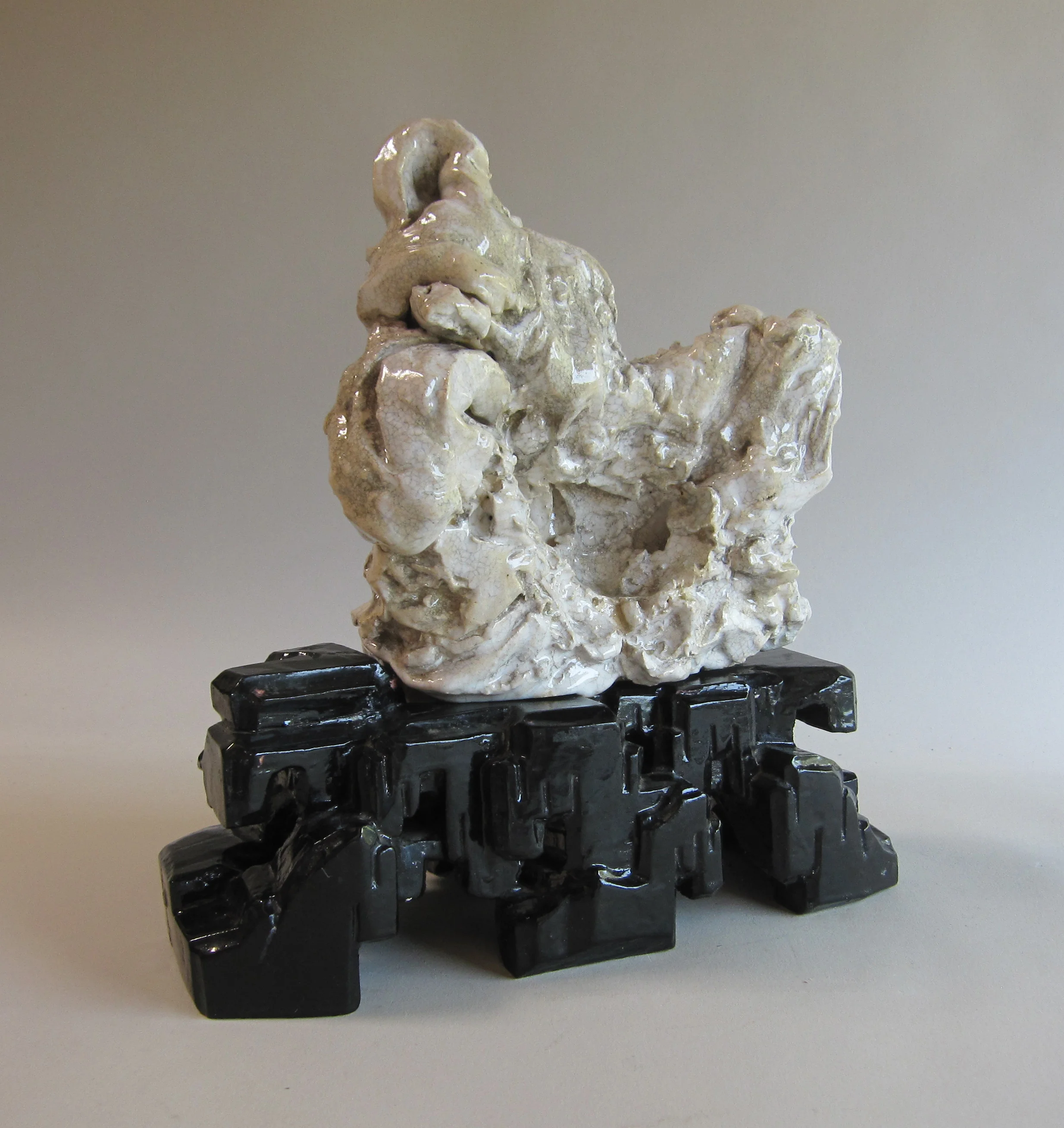   Ceramic on painted wood base  