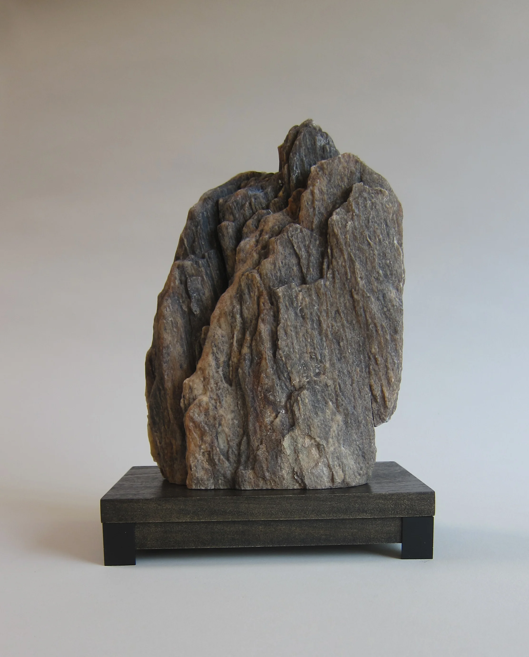   Mojave desert stone, wood, painted aluminum.  