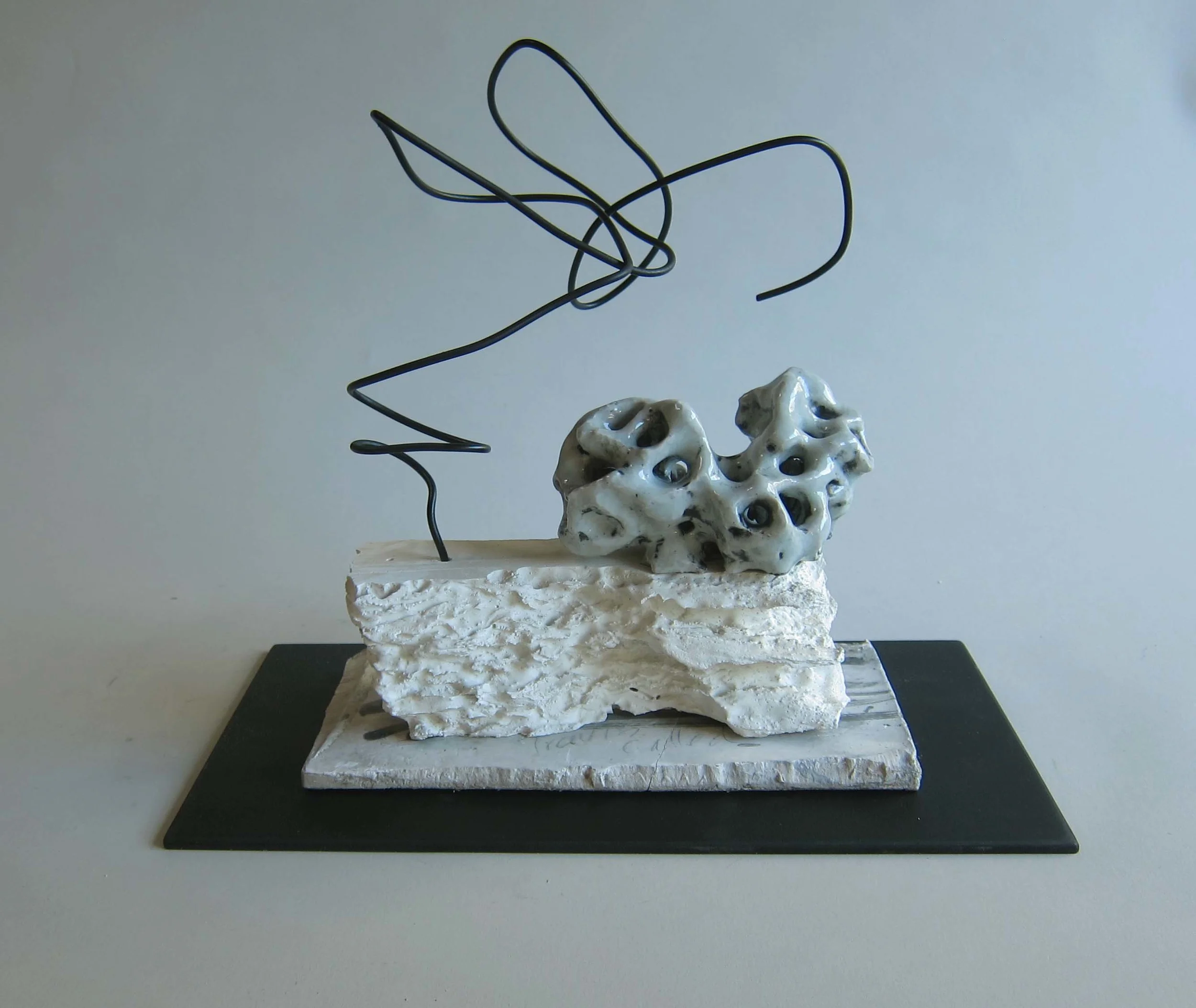  Ceramic, plaster, aluminum wire, painted Masonite.&nbsp;  