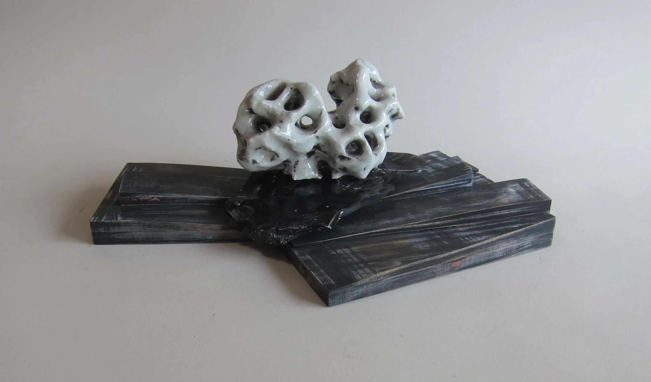   Ceramic, obsidian, wood, enamel paint.&nbsp;  