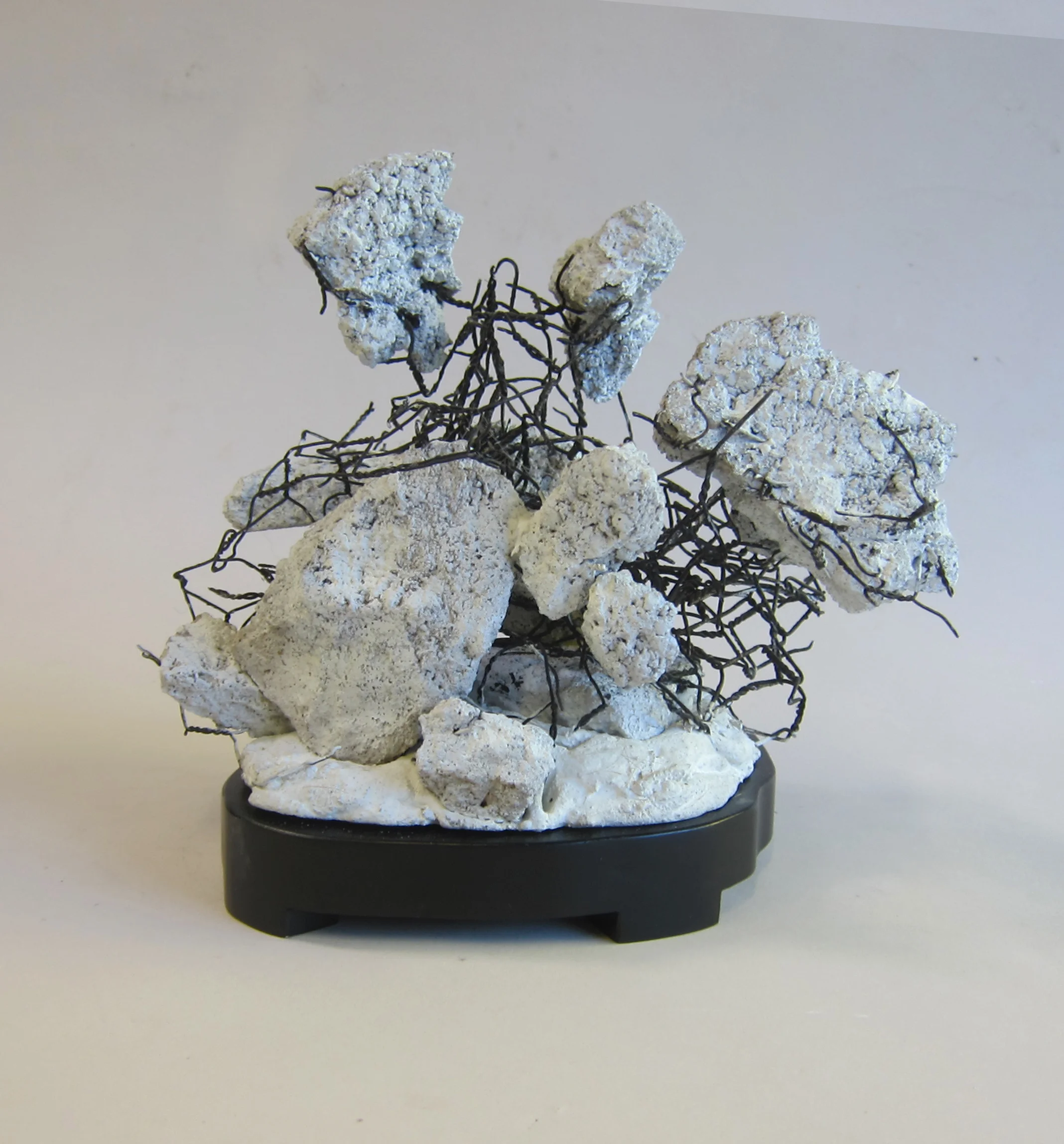   Cement, enamel paint, wire mesh, wood.&nbsp;  