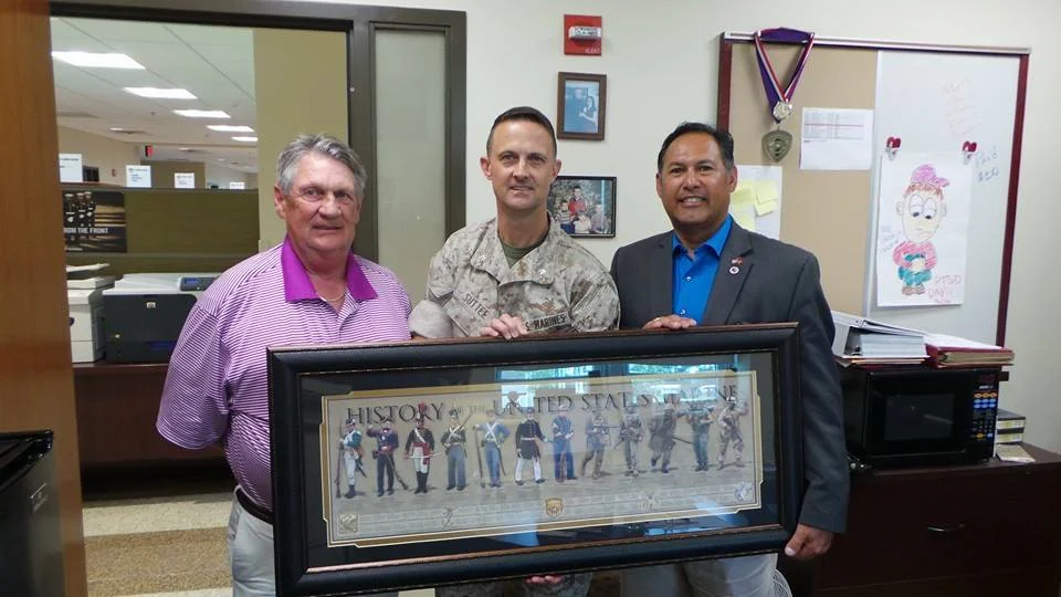 Food Industry Serving Heroes board members Johnny Harris and Paul Chapa present donation to Wounded Warrior Battalion East. Accepting is Commanding Officer Lt Col. Leland Suttee, USMC.