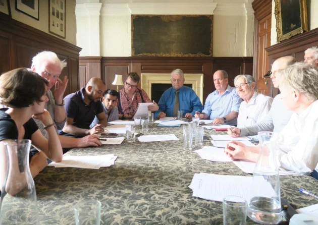 The members of the 2015-2016 Forum Council meeting in the parish vestry.
