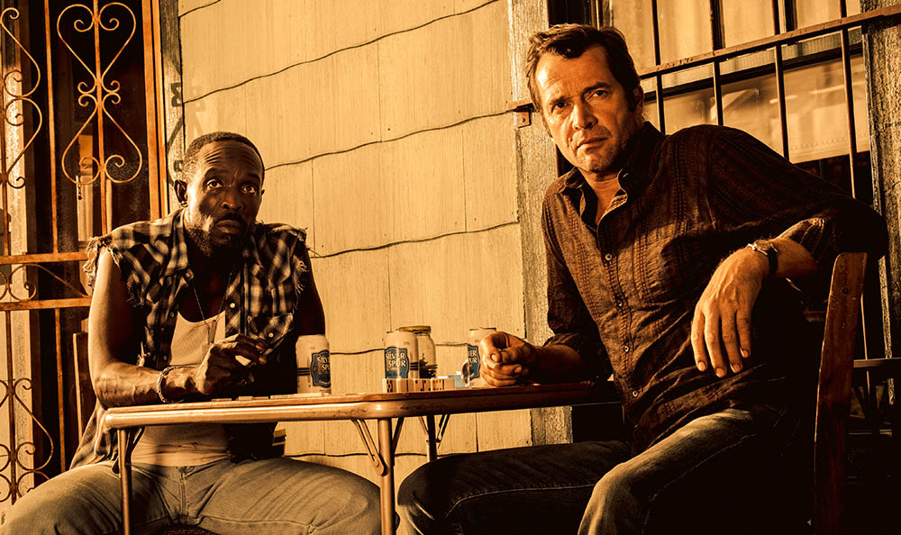 Michael Kenneth Williams as Leonard Pine and James Purefoy as Hap Collins