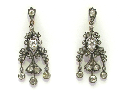 4.15cts of old mine, rose cut and antique pear diamonds set in silver, backed in 18k rose gold. 