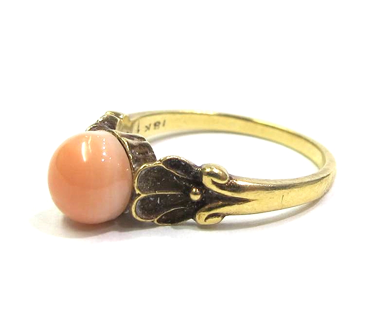 18K yellow gold ring with coral cabouchon, signed G. Jensen, at Gray & Davis.
