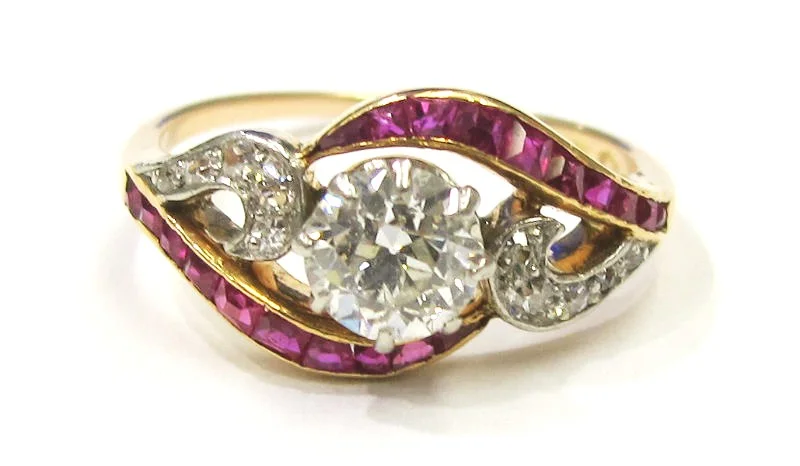 14k rose gold/platinum ring with .65ct I color, SI1clarity Old European diamond center and ruby accents. Viennese assay marks c.1900