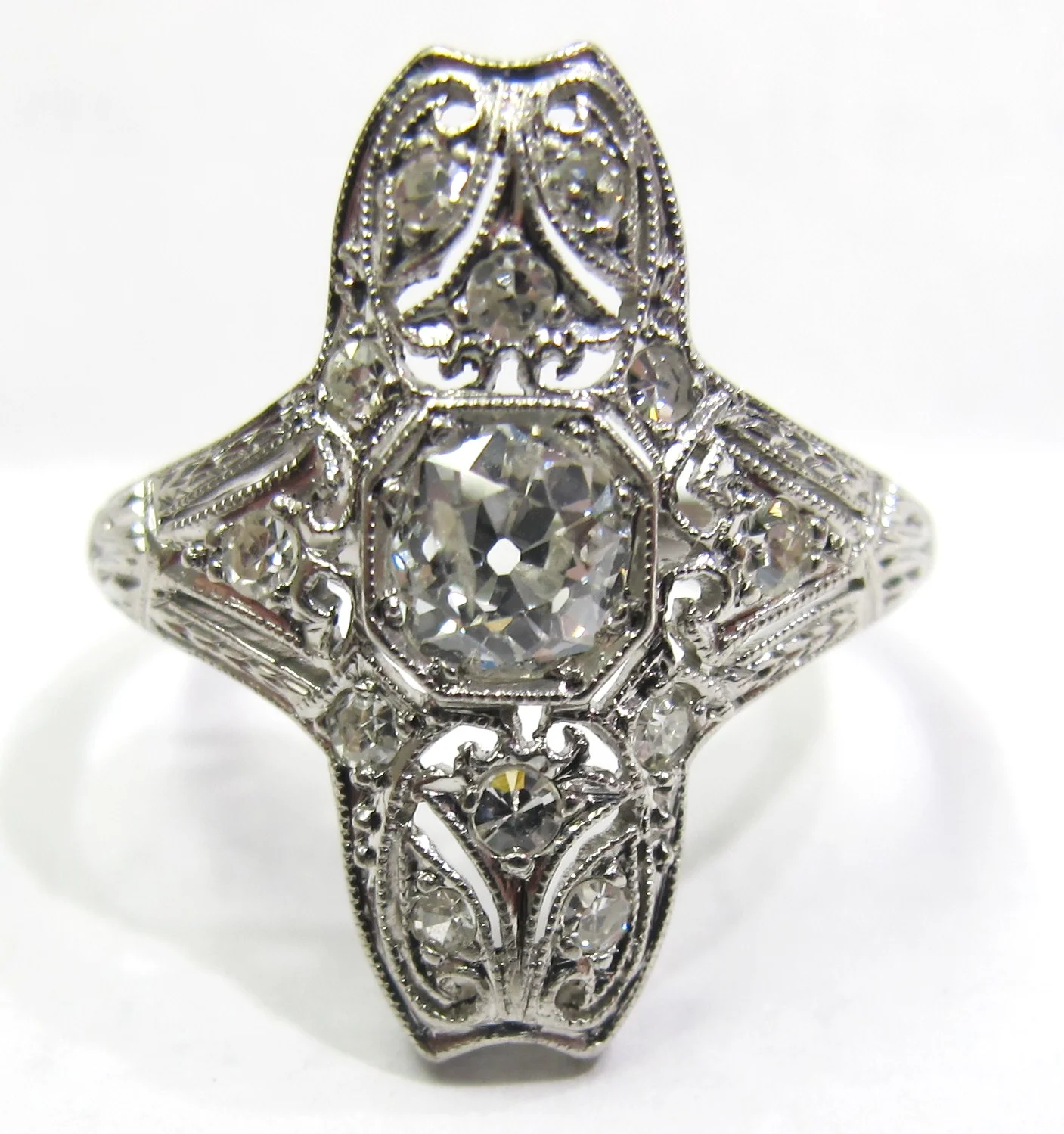 Fashioned in platinum with .45ct F color, I1 clarity old mine cut center diamond and single-cut diamond accents. Made c.1905.