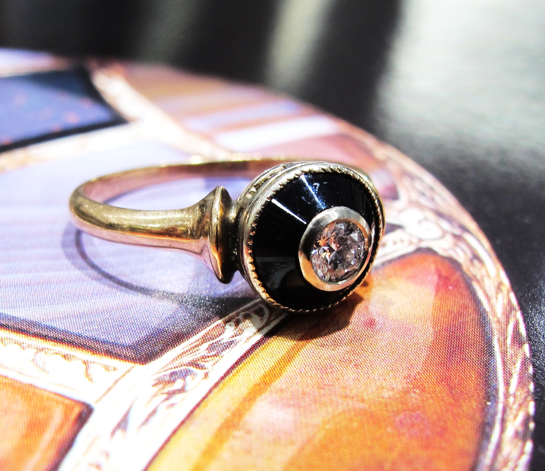 10k gold, onyx, .15ct old European cut diamond, c. late Victorian era