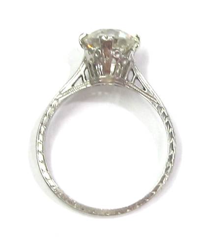 Platinum ring w/engraved detailing and 1.63 carat J color, VS2 clarity old European cut diamond. Art Deco, c. 1924.