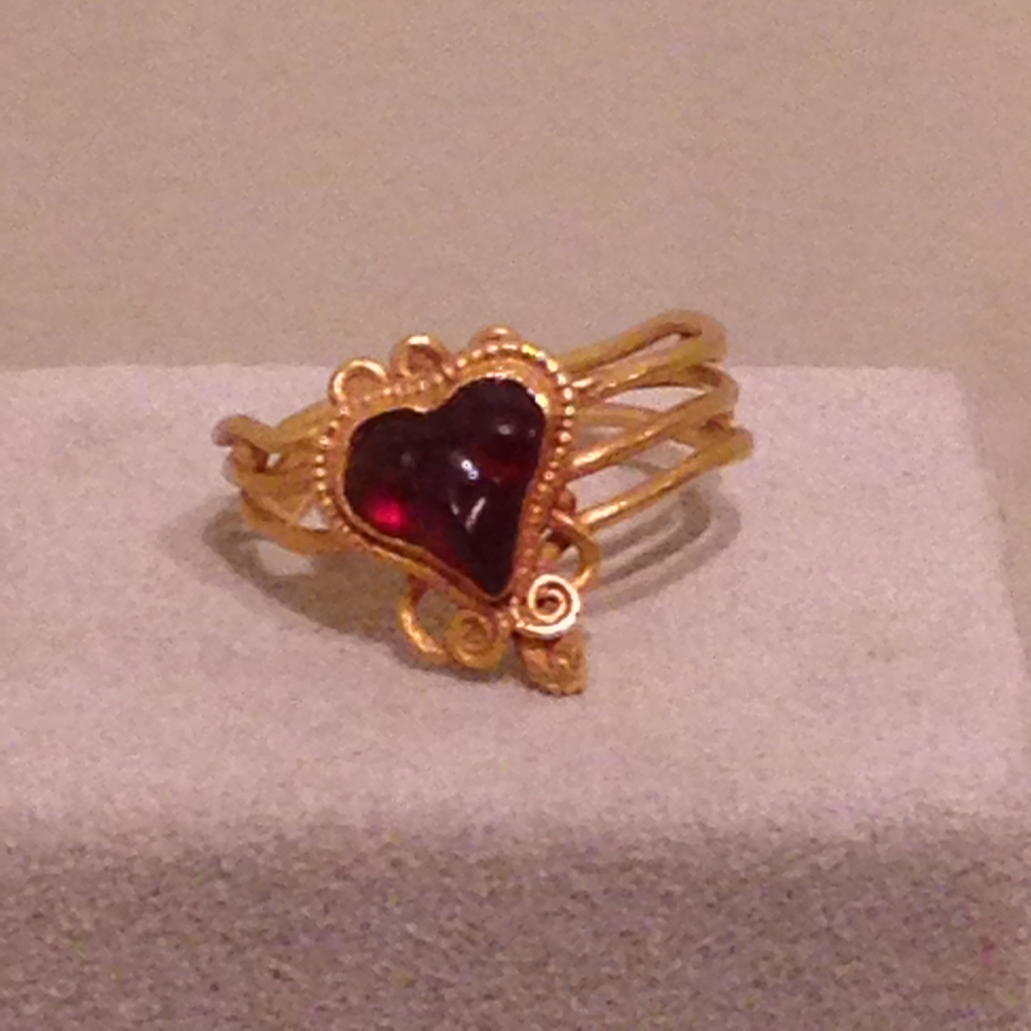 Greek snake ring with a garnet heart; Hellenistic Greece, 2nd-1st century BC.